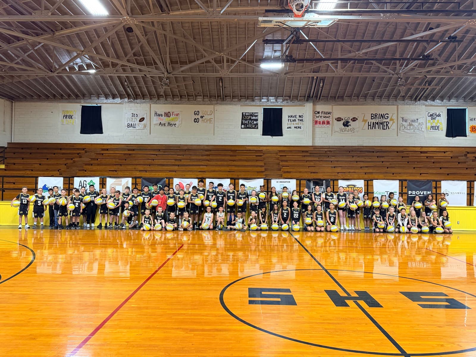 The whole league lined up in the Old Gym holding basketballs